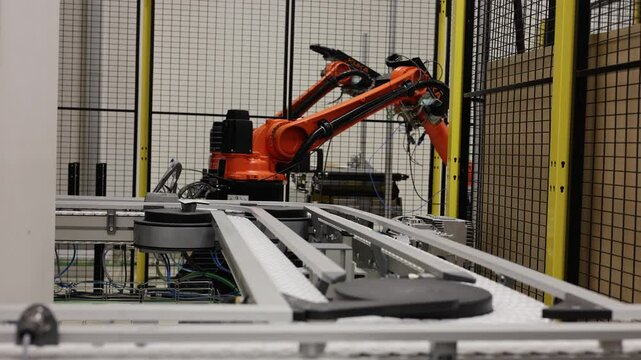 Robots work in a factory without humans