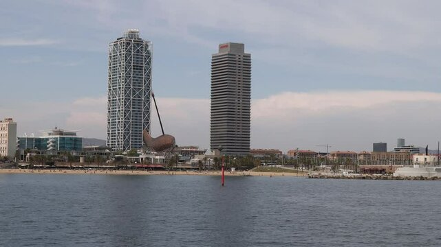 View from the sea with Torre Mapfre, Hotel Arts and the El Peix d'Or, barcelona, Spain