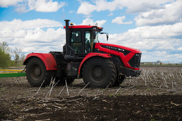 Tractor close-up. Agricultural machinery in the field