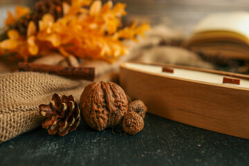 Candle in a wooden container, cozy autumn decor