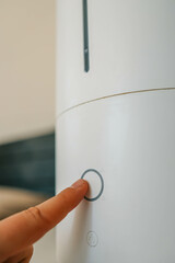 Turning on the air humidifier in the bedroom for a comfortable sleep and maintaining indoor humidity