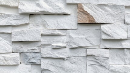 Textured white stone wall tiles arranged in an organized pattern for modern interior design