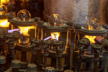 Processing line of light bulb factory with special equipment for working with hot melting glass tube.