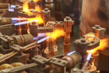 Processing line of light bulb factory with special equipment for working with hot melting glass tube.