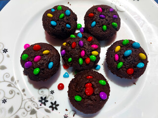 Chocolate muffin cake with colorful decoration