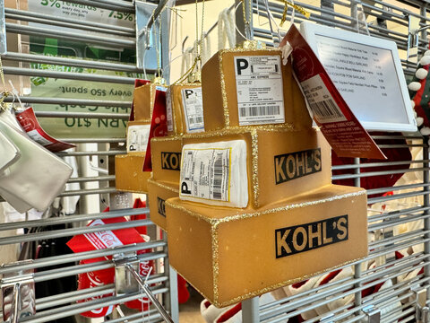 Manassas, Virginia - September 29, 2024: Kohls Christmas ornament with online shopping shipping boxes
