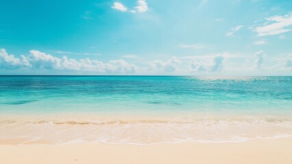 Fototapeta premium A sunny beach paradise with soft sand, clear blue water, and a bright sky filled with fluffy clouds, perfect for a relaxing summer vacation