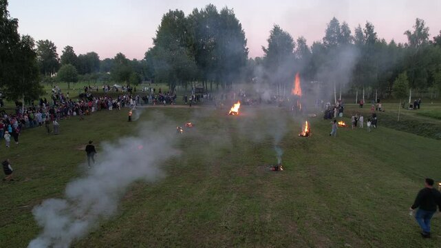 burning cart wheels filled with hay