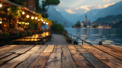 Empty wooden table and view of Lake Como at dusk