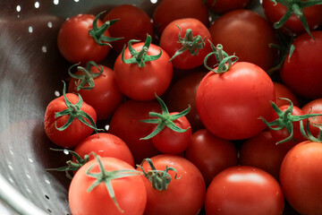 Tomatoes lying in a pile on top of each other, fresh tomato from garden. Texture. Selective focus.