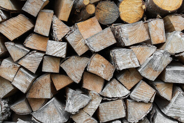firewood in the yard, a stack of neatly chopped firewood