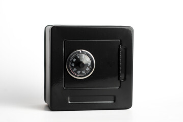 Black safe with combination lock on white background for security solutions
