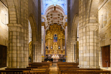 Interior view of the nave and altar of the 12th century Porto Cathedral, a Roman Catholic cathedral in the center of the old town district of Porto Portugal.	