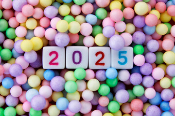 Welcome to the new year 2025 surrounded with colorful spheres