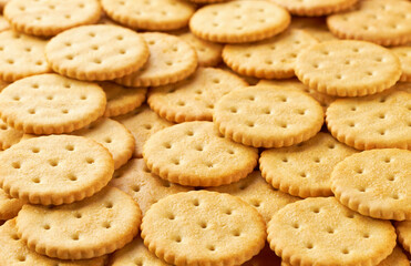 Crackers placed throughout the screen selective focus. Food background.