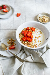 Homemade pellet with milk and strawberries. Prepared breakfast for the whole family in a ceramic plate. 