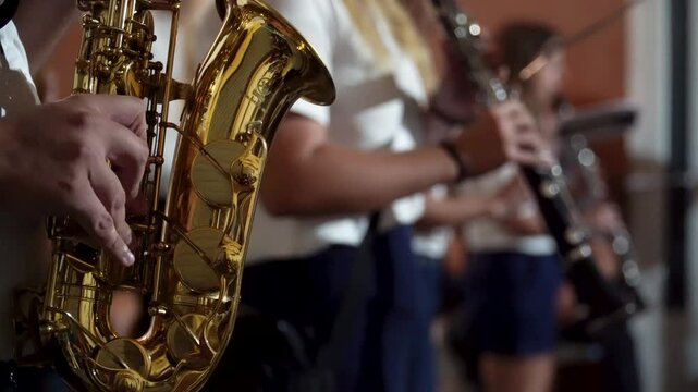 Closeup, a musician playing the saxophone in the parade