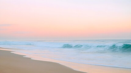 Tranquil beach scene at sunrise with gentle waves lapping at the shore and soft pastel colors