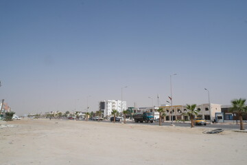 Obraz premium A sunny day in Nouakchott, Mauritania showcasing the beachside boulevard and vibrant local architecture by the sea