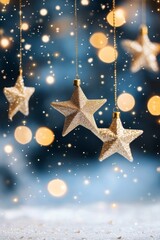 Fototapeta premium Decorative glittering stars hanging against a soft blue backdrop illuminated by festive lights
