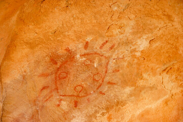 Ancient rock art depicting a sun symbol in Mauretania’s Agrour Amogjar region showcases prehistoric cultural expression