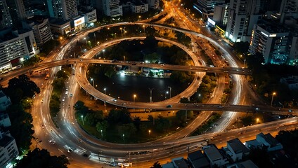 Nighttime aerial view of a roundabout in Bangkok, Thailand.