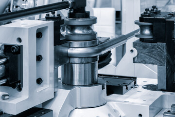 industrial device for bending of metal pipes and plates,  industrial concept background