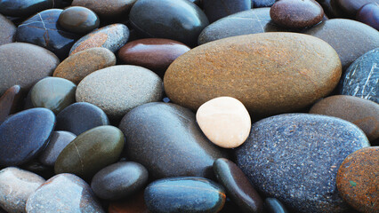 Abstract smooth round pebbles sea texture background.