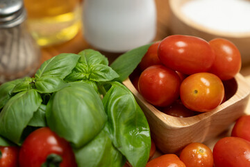 Health food's recipe ingredients of special menu homemade cooking sauce with tomato and basil of macro photo shooting placing elements on preparing wooden table surround blurred background. Postulate.