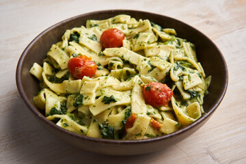 Penne rigatte with blue cheese sauce and tomatoes