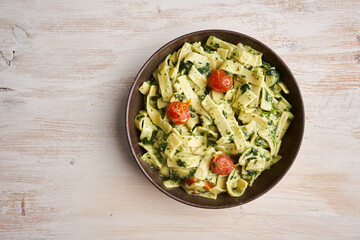 Penne rigatte with blue cheese sauce and tomatoes