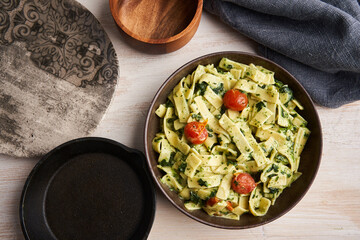 Penne rigatte with blue cheese sauce and tomatoes