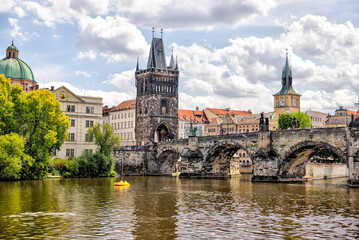 Prague, Czech Republic - July 19, 2024: Morning views along the Vltava River and Charles Bridge n Prague in the Czech Republic

