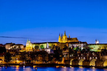 Prague, Czech Republic - July 16, 2024: Nighttime views of the Charles Bridge, Prague Castle and...