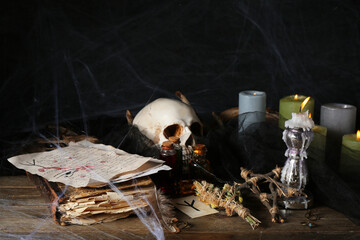 Witch's magic attributes on dark wooden table