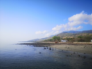 Discover the tranquil beauty of Atauro Island in Timor-Leste's serene coastal landscape during a sunny day