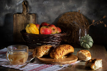 Fresh baked goods and apple compote in glass cup on rustic table