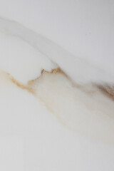 Light marble background. Grey-beige background with a brown spot. Smooth surface. Granite tiles....
