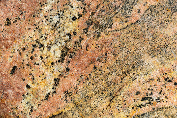 Rough texture of natural stone, red granite rock