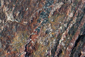 Rough texture of natural stone, red granite rock	
