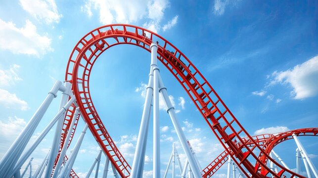 A red rollercoaster track curves upwards against a bright blue sky with white clouds.