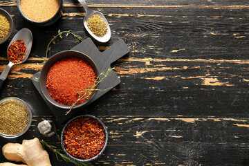 Composition with fresh aromatic spices on dark wooden background