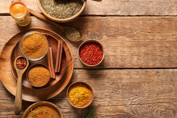 Composition with fresh spices on wooden background