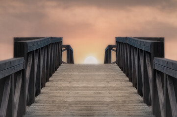 Fototapeta premium sunset view from wooden pier bridge
