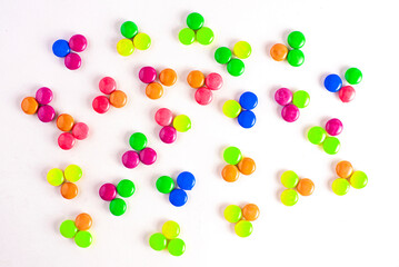 Gourmet chocolate candy assortment laid out on slate background
