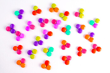 Gourmet chocolate candy assortment laid out on slate background