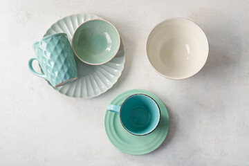 Set of clean tableware on white grunge background. Top view