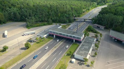 Dreilinden border crossing cars on highway. Dramatic aerial view flight drone