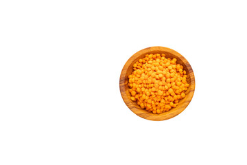 Raw red lentils in a bowl - Lens culinaris.