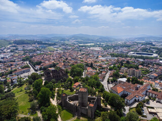 Aerial view of Guimaraes city, Castelo Guimaraes Castle and Pa&ccedil;o dos Duques. Cityscape seen from the air. Portugal. Drone